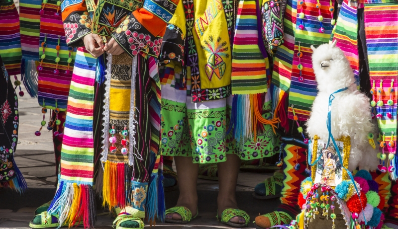 Peruvian dancers at the parade in Cusco. People in traditional clothes.